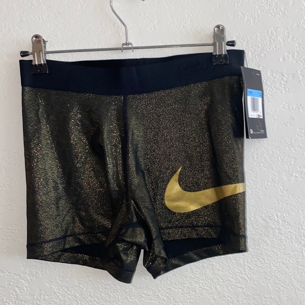 Metallic gold Nike pro shorts size medium but fits like a small